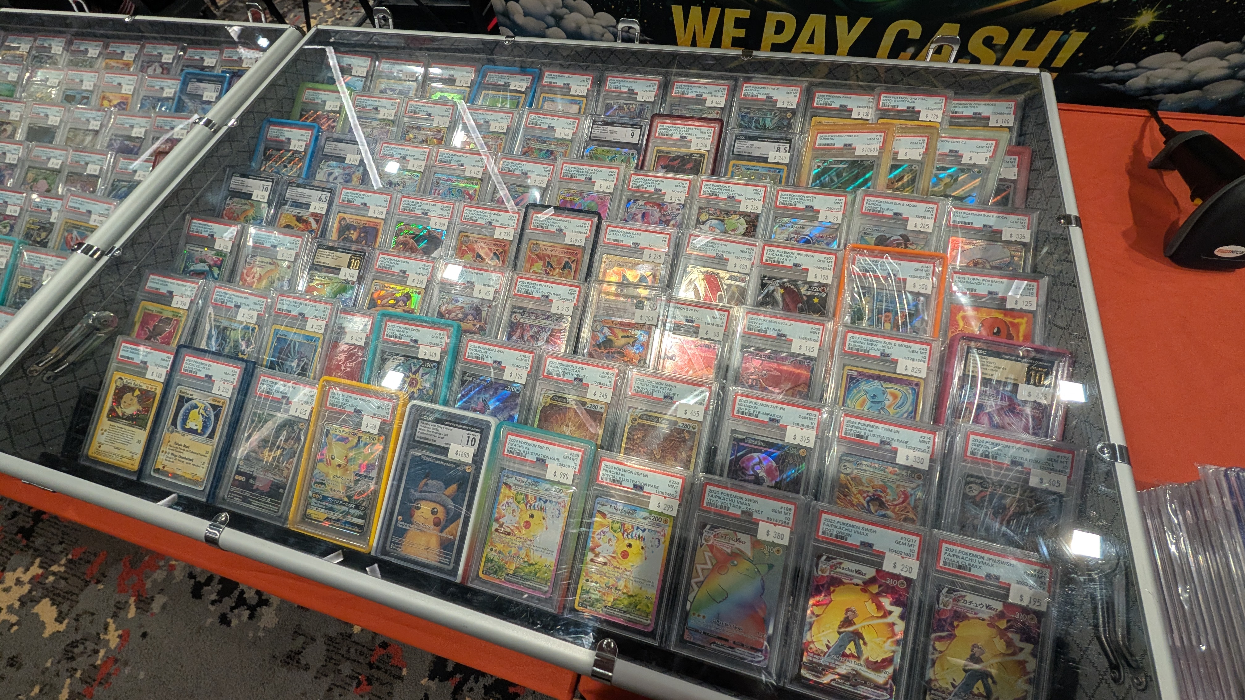 Display case with Pokémon TCG inventory